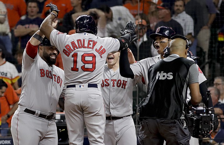 Boston Red Sox’s Jackie Bradley Jr. celebrates after his grand slam against the Houston Astros during the eighth inning in Game 3 of a baseball American League Championship Series on Tuesday, Oct. 16, 2018, in Houston. (David J. Phillip/AP)