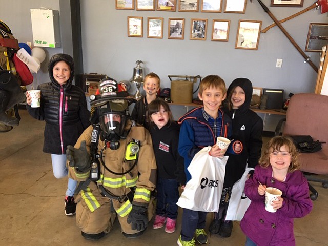 Captain Ryan Kopicky demonstrates firefighter safety equipment during Community Safety Day at Williams Fire Department Oct. 13. (Williams Fire Department)