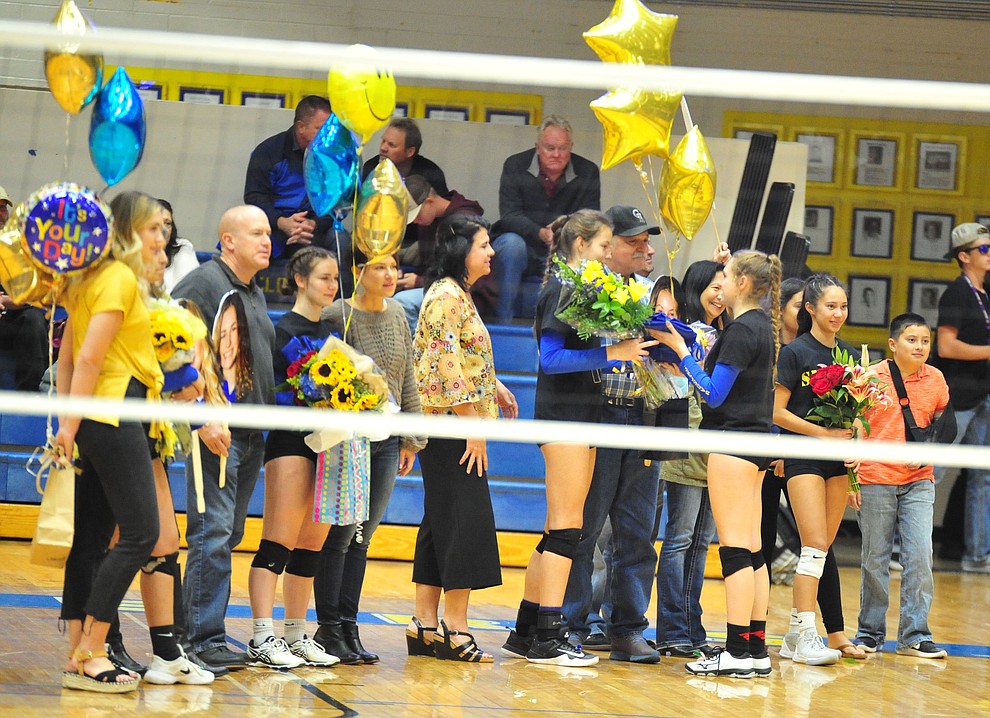 Seniors Angelina Jennison, Sabina Dimaano-Simmons, Danielle Dreher and Tessandra Rothfuss and their families were honored on senior night before Prescott hosted the Flagstaff Eagles in volleyball Thursday, Oct. 18, 2018 in Prescott. (Les Stukenberg/Courier)