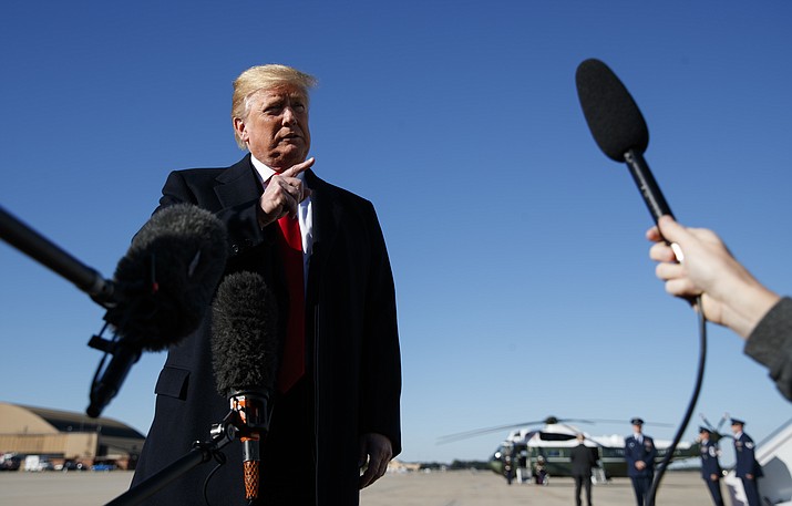 President Donald Trump talks to reporters as before boarding Air Force One, Thursday, Oct. 18, 2018, in Andrews Air Force Base, Md., en route to campaign stops in Montana, Arizona and Nevada. (Carolyn Kaster/AP)