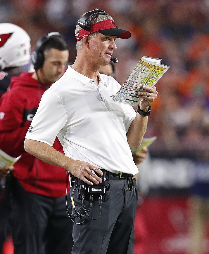 Former Arizona Cardinals offensive coordinator Mike McCoy call a play during the first half of an NFL football game against the Denver Broncos, Thursday, Oct. 18, 2018, in Glendale, Ariz. The Cardinals announced Friday, Oct. 19, 2018, that McCoy has been relieved of his duties and that quarterbacks coach Byron Leftwich will assume his position. (AP Photo/Ralph Freso)