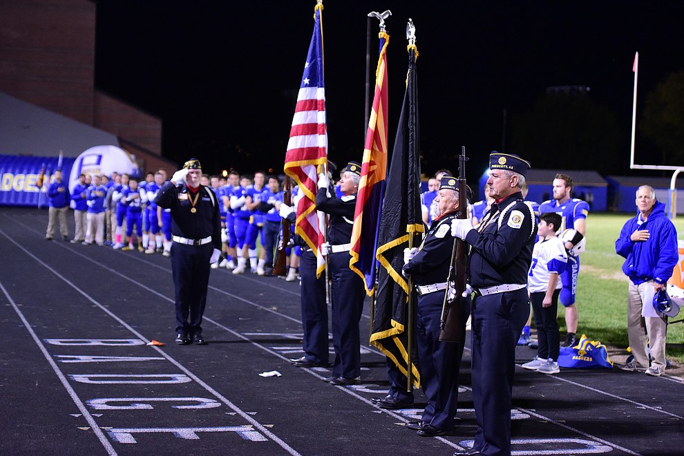 Prescott American Legion Post 6 Color Guard presents the colors before the Badgers take on Lee Williams Friday, Oct. 19, 2018 in Prescott. (Les Stukenberg/Courier)