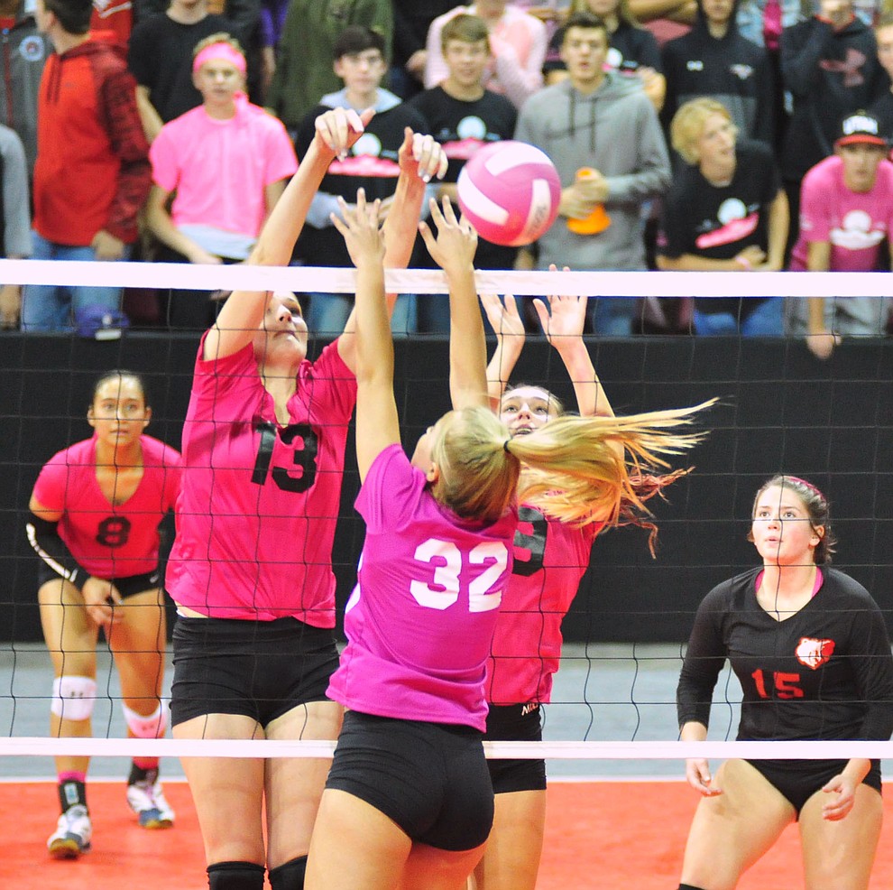 Bradshaw Mountain's Alyssa Weissenberger and Peyton Bradshaw get a block on Tessandra Rothfuss as the Bears played Prescott in the Mile High Battle Against Cancer volleyball match at the Prescott Valley Event Center Tuesday, Oct. 23, 2018.(Les Stukenberg/Courier)