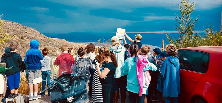 Tour guide Joe Westcott gives a tour to a group of kids in Jerome. Westcott said he never liked high school but wants to prove with his tours that learning history can be fun. When he conducts his tours, he always encourages people to ask questions – especially kids. Courtesy photo