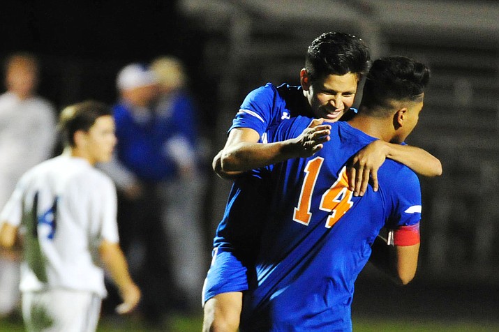 Chino Valley’s Irving Vedolla congratulates Angel Sanchez on his first half goal as the Cougars play Snowflake in the quarterfinals 2A state tournament Wednesday, Oct. 24, 2018 in Chino Valley.(Les Stukenberg/Courier)
