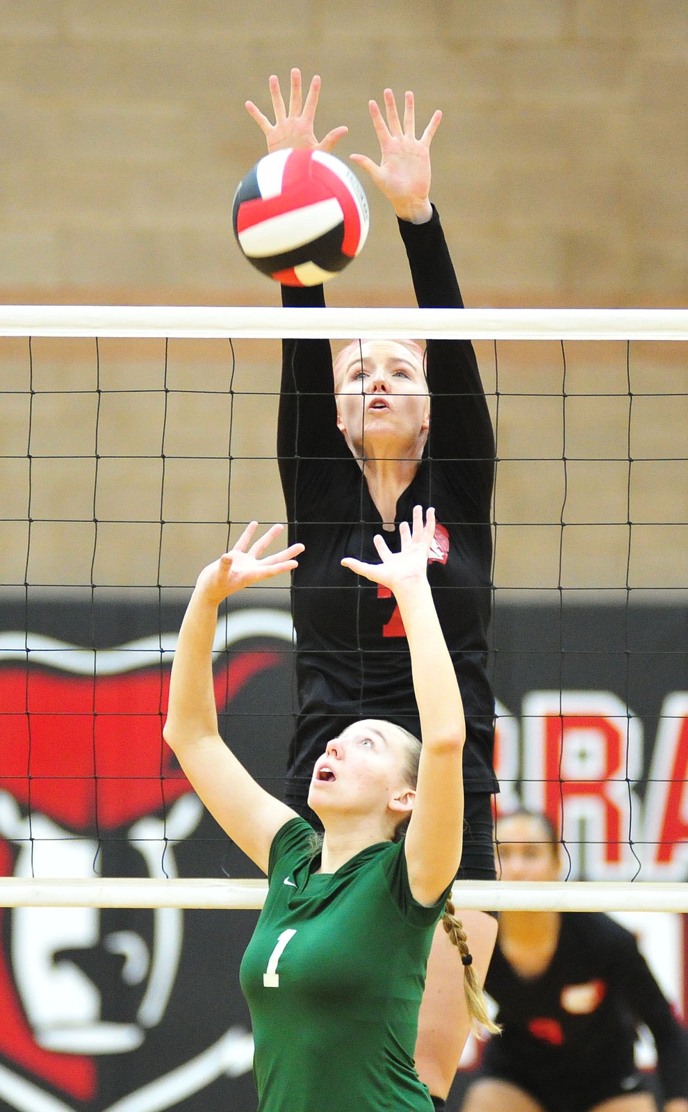 Bradshaw Mountain's Rylee Bundrick goes high for a block as the Bears play in the play-in game for the AIA 4A State Volleyball Tournament against Peoria Thursday, Oct. 25, 2018 in Prescott Valley. (Les Stukenberg/Courier).