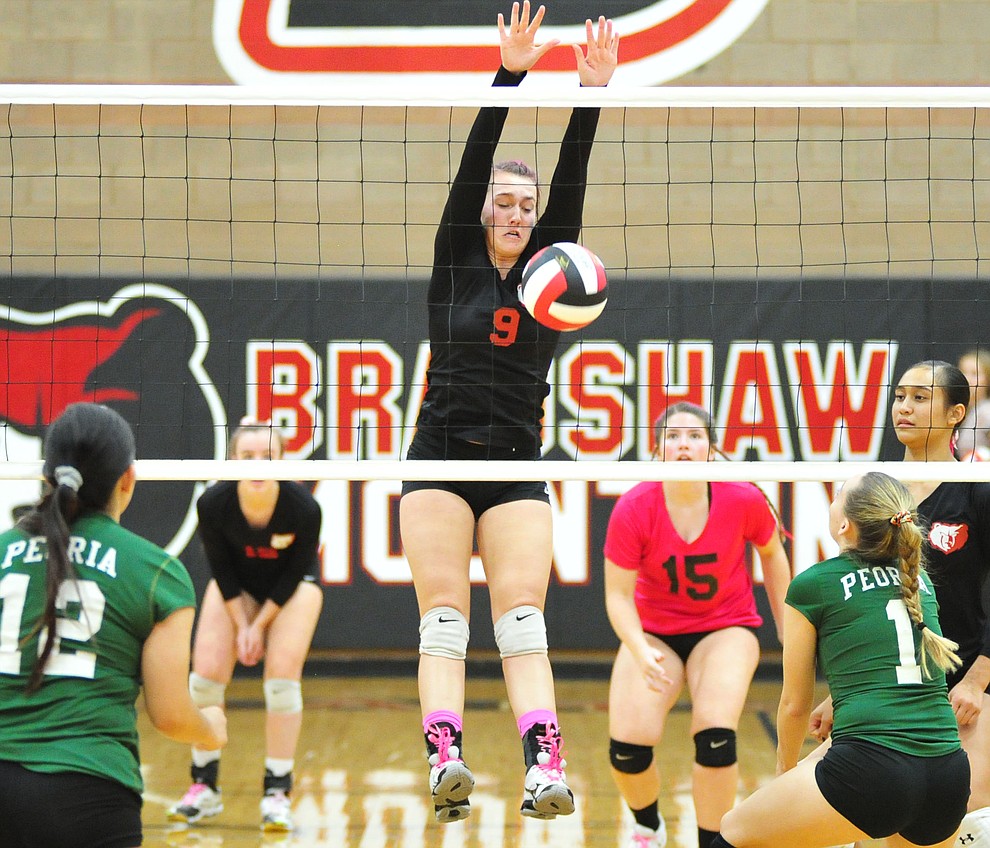 Bradshaw Mountain's Peyton Bradshaw slams down a block as the Bears play in the play-in game for the AIA 4A State Volleyball Tournament against Peoria Thursday, Oct. 25, 2018 in Prescott Valley. (Les Stukenberg/Courier).