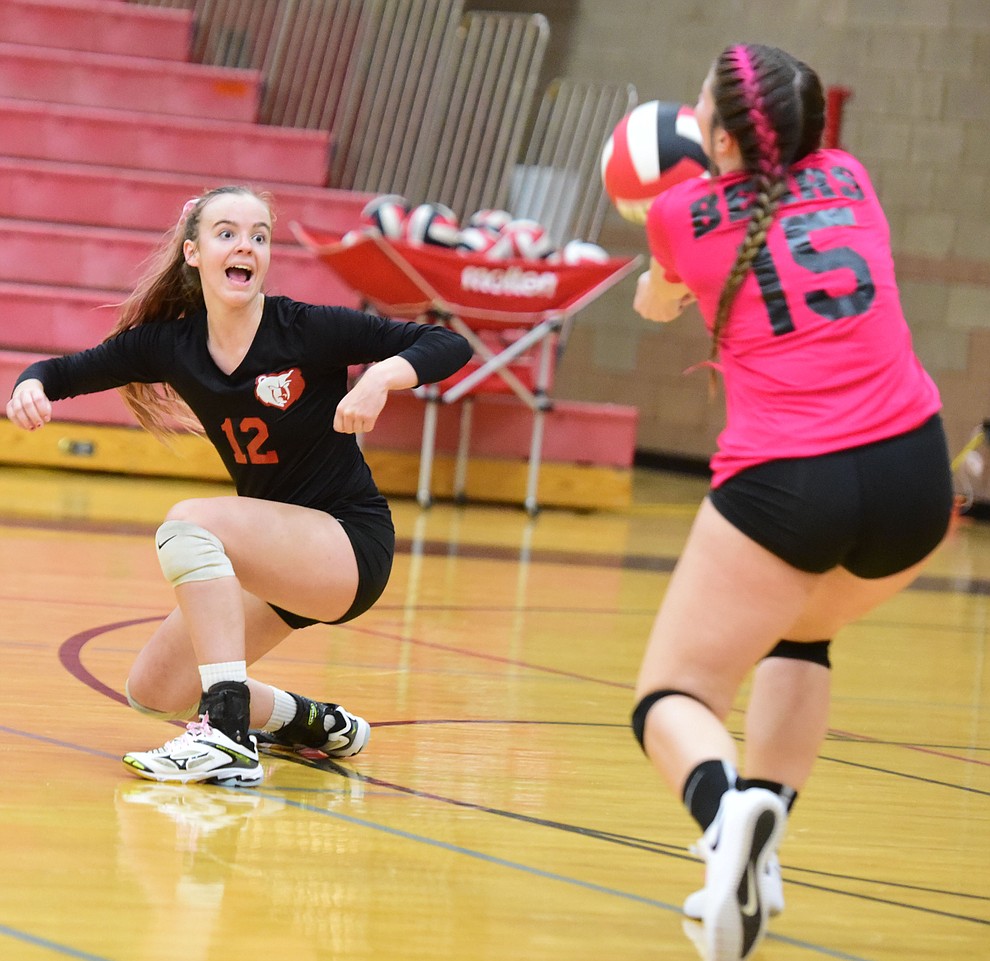 Bradshaw Mountain's Jordyn Moser reacts as Reillie Smith gets a serve as the Bears play in the play-in game for the AIA 4A State Volleyball Tournament against Peoria Thursday, Oct. 25, 2018 in Prescott Valley. (Les Stukenberg/Courier).