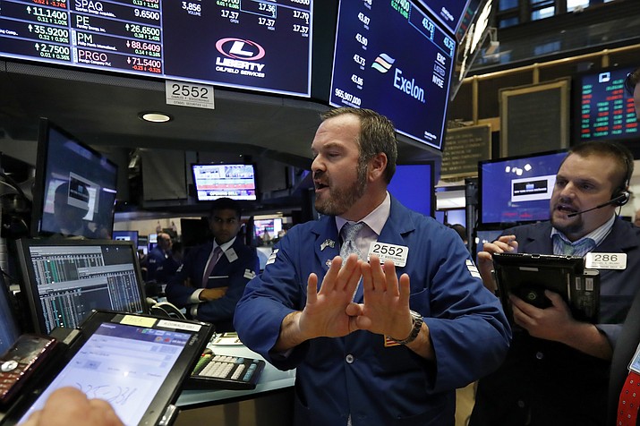 Specialist Charles Boeddinghaus, center, and trader Michael Milano work on the floor of the New York Stock Exchange, Wednesday, Oct. 24, 2018. Stocks are off to a mixed start on Wall Street as gains for Boeing and other industrial companies are offset by losses elsewhere in the market. (Richard Drew/AP)