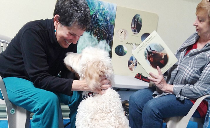 Bubba Pietrandoni and Donna communicate while mom Kathy reads Donna’s book. Donna has known Bubba since his puppyhood. They have developed a special bond, very special communication and a deep friendship. (Christy Powers/Courtesy)