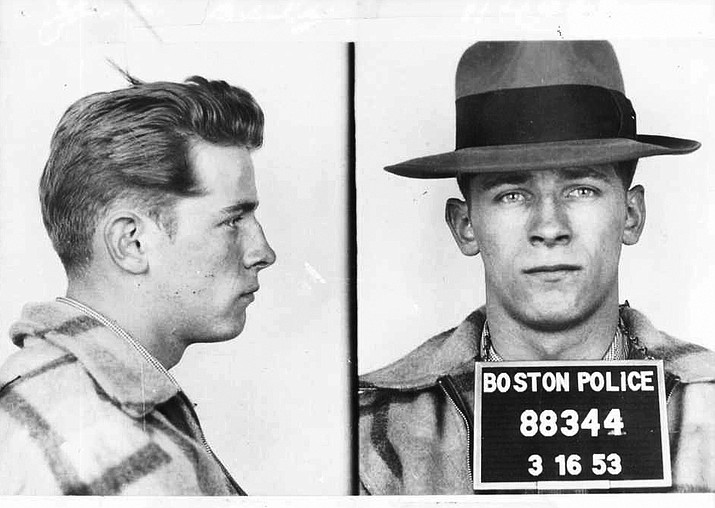 These 1953 file Boston police booking photos provided by The Boston Globe shows James "Whitey" Bulger after an arrest. Officials with the Federal Bureau of Prisons said Bulger died Tuesday, Oct. 30, 2018, in a West Virginia prison after being sentenced in 2013 in Boston to spend the rest of his life in prison. (Boston Police/The Boston Globe via AP)