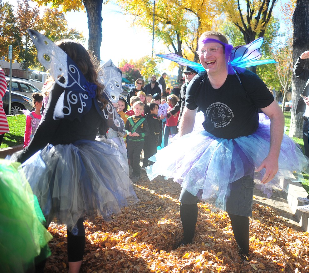 Prescott Unified School District Chief Financial Officer Brian Moore has some fun as students from Lincoln Elementary School hold their annual Halloween parade around the Courthouse Plaza in Prescott Wednesday, Oct. 31, 2018.  (Les Stukenberg/Courier).