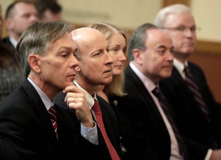 In this Dec. 19, 2016, file photo, Arizona Supreme Court justices from left; Chief Justice Scott Bales, John Pelander, Ann A. Timmer, Clint Bolick and Vice Chief Justice Robert Brutinel attend a ceremony. Assistant Attorney General Rusty Crandell is asking the U.S. Supreme Court to reinstate a voter-approved provision of the Arizona Constitution that allows accused rapists to be held without bail while awaiting trial. (Matt York/AP, file)