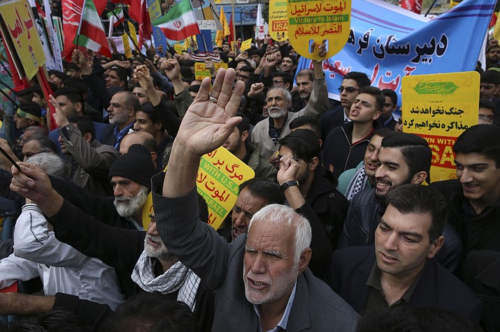 Demonstrators chant slogans during an annual rally in front of the former U.S. Embassy in Tehran, Iran, on Sunday, Nov. 4, 2018, to mark the 39th anniversary of the seizure of the embassy by militant Iranian students. Thousands of Iranians rallied in Tehran on Sunday to mark the anniversary as Washington restored all sanctions lifted under the nuclear deal. (Vahid Salemi/AP)