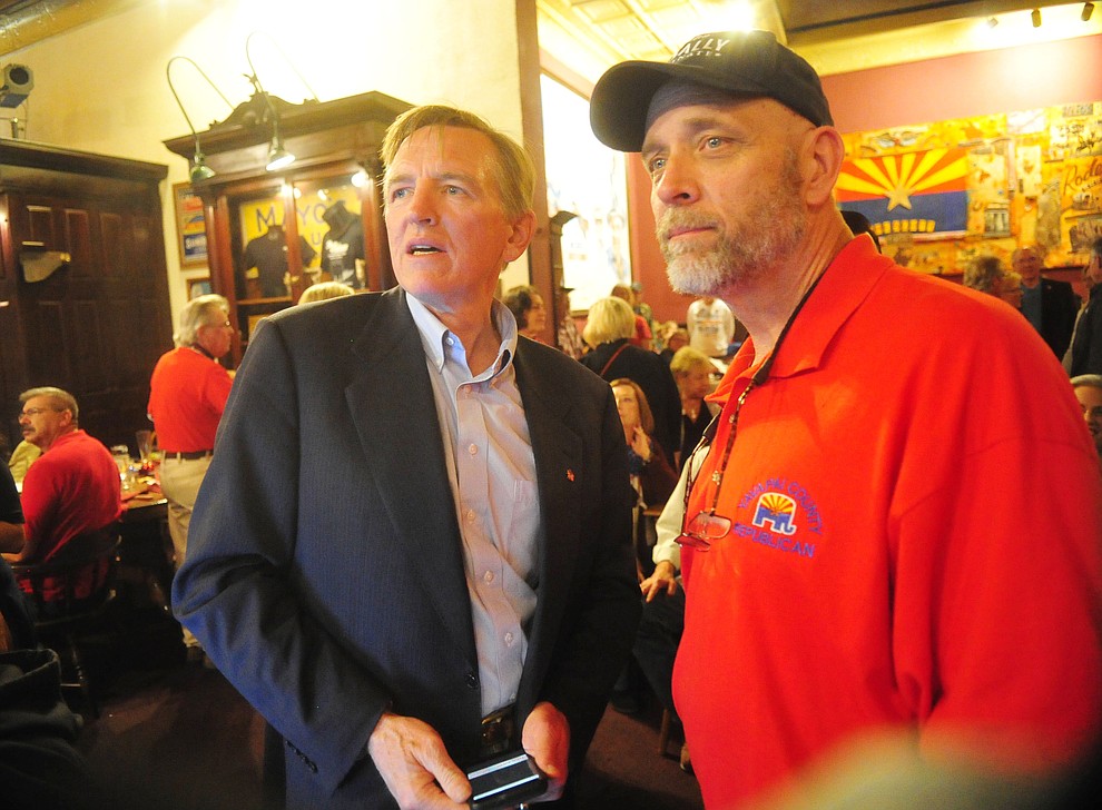 Arizona Congressman Paul Gosar, left, watches early returns with Yavapai County Republican Party Chairperson Mark Sensmeier during a Republican election night party at the Palace Restaurant & Saloon Tuesday, Nov. 6, 2018 in Prescott.  (Les Stukenberg/Courier).