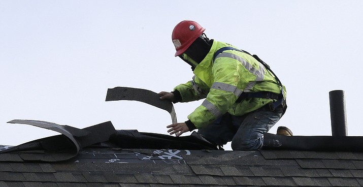 Before hiring a contractor, homeowners should ask for proof of a license and insurance. (Charles Krupa/AP, file)