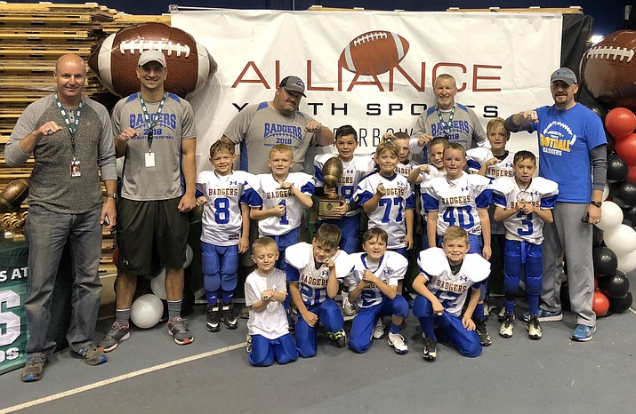 The mighty mite Prescott Badgers football team shows off their championship rings after a 20-6 victory over Flagstaff on Saturday, Nov. 3, 2018, at the NAU Walkup Skydome in Flagstaff. (Courtesy)