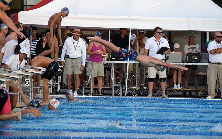 Mingus junior Andrew Peterson dives into a pool during a relay at the state meet. The boys 200 Free relay finished second a set a school record and Peterson finished 11th and 15th individually. VVN/James Kelley