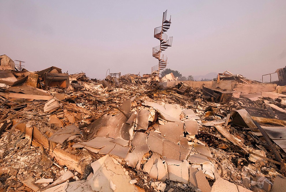 The charred remains of the burned out home are seen in Malibu, Calif., Saturday, Nov. 10, 2018. Officials took advantage of temporarily calm conditions Saturday to assess damage from the blaze that's burned 109 square miles outside downtown Los Angeles. (AP Photo/Ringo H.W. Chiu)