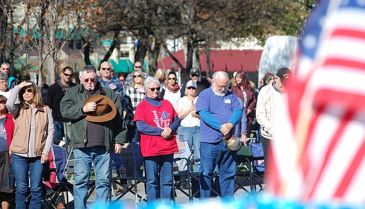 The 2018 Veterans Day Parade, in downtown Prescott Saturday, Nov. 10, began with the Pledge of Allegiance, the National Anthem, and a moment of silence. (Tim Wiederaenders/Courier)