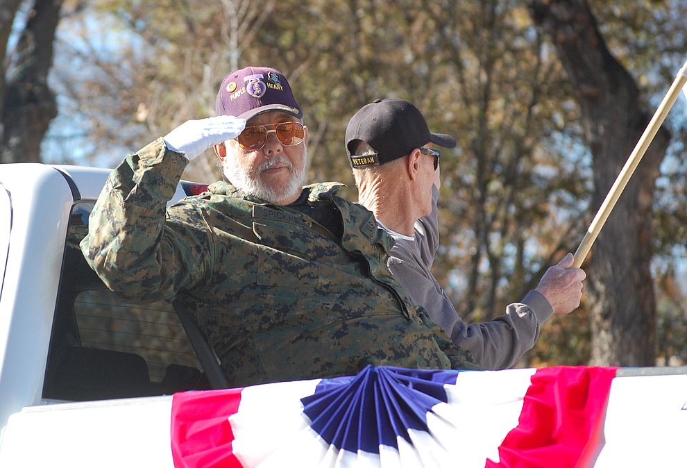 Dennis Spicknell of the Shining Star Program, Veterans Helping Veterans, salutes during the 2018 Veterans Day Parade, which went around the courthouse plaza in downtown Prescott on Saturday, Nov. 10. (Tim Wiederaenders/Courier)