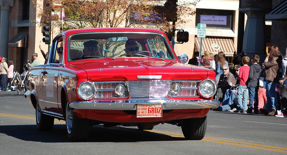 The 2018 Veterans Day Parade - including vintage automobiles, floats, horses, bands and more - makes its way around the courthouse plaza in downtown Prescott on Saturday, Nov. 10. (Tim Wiederaenders/Courier)