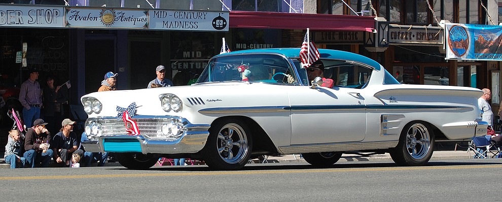 The 2018 Veterans Day Parade - including vintage automobiles, floats, horses, bands and more - makes its way around the courthouse plaza in downtown Prescott on Saturday, Nov. 10. (Tim Wiederaenders/Courier)