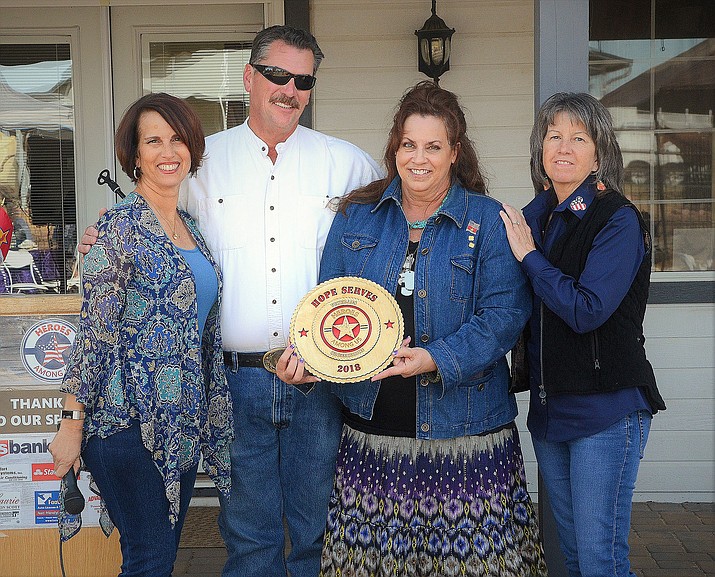 Cristi Rose, left, founder/executive director of Bethany’s Gait Ranch, and Prescott Valley  Town Councilwomen Mary Mallory, right, present the Heroes Among Us — Organization Award to David and Jaye Lene Long, the founders and directors of HOPE Serves Foundation and host to HOPE FEST Arizona. (David Cottle/Courtesy)