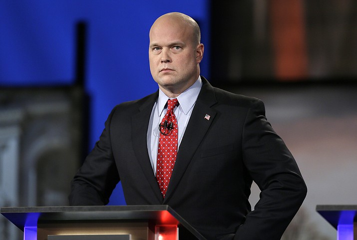 In this April 24, 2014, file photo, then-Iowa Republican senatorial candidate and former U.S. Attorney Matt Whitaker watches before a live televised debate in Johnston, Iowa. Maryland is challenging the appointment of Matthew Whitaker as the new U.S. acting attorney general. A draft filing obtained Tuesday by The Associated Press argues that President Donald Trump sidestepped the Constitution and normal procedure by naming Whitaker to the position in place of Deputy Attorney General Rod Rosenstein. (Charlie Neibergall/AP, File)