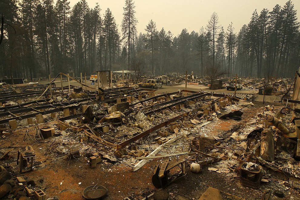 Rubble remains where mobile homes once stood at the Camp Fire, Monday, Nov. 12, 2018, in Paradise, Calif. (AP Photo/John Locher)