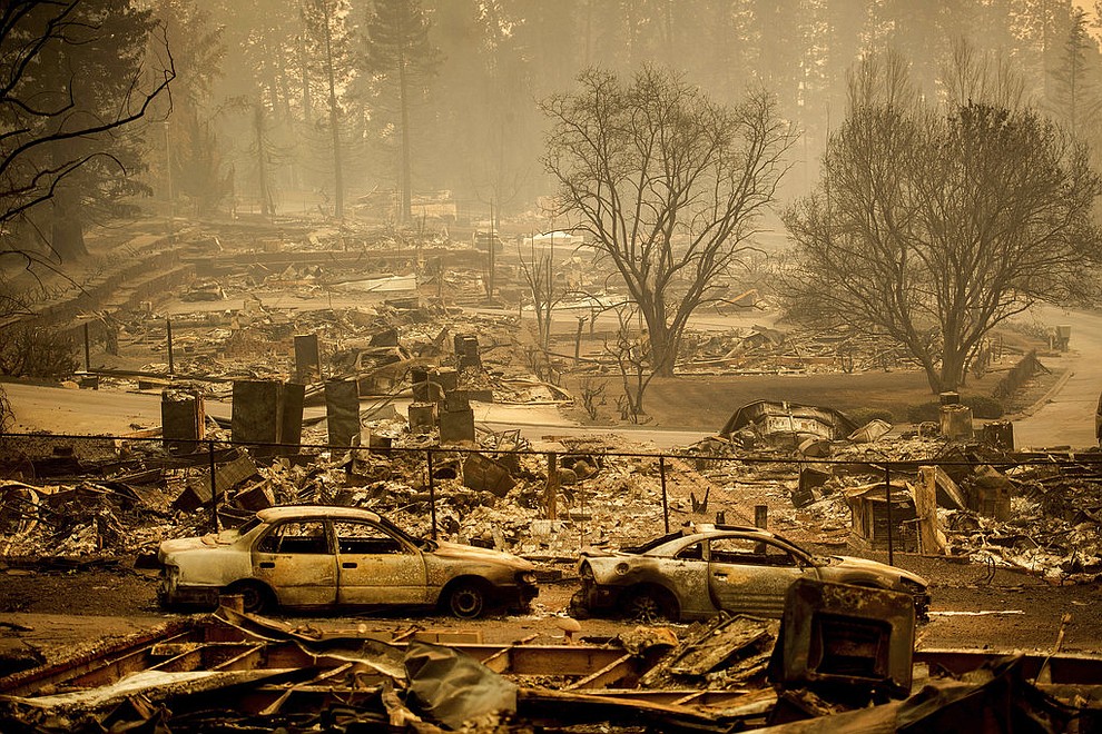 Homes leveled by the Camp Fire line a development on Edgewood Lane in Paradise, Calif., Monday, Nov. 12, 2018. (AP Photo/Noah Berger)