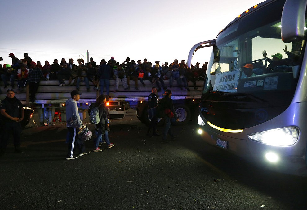 Central American migrants get a ride on a bus provided by a group of humanitarian aid, in Ixtlán del Rio, Nayarit, Mexico, Tuesday, Nov. 13, 2018. The U.S. government said it was starting work Tuesday to "harden" the border crossing from Tijuana, Mexico, to prepare for the arrival of a migrant caravan leapfrogging its way across western Mexico. (AP Photo/Marco Ugarte)