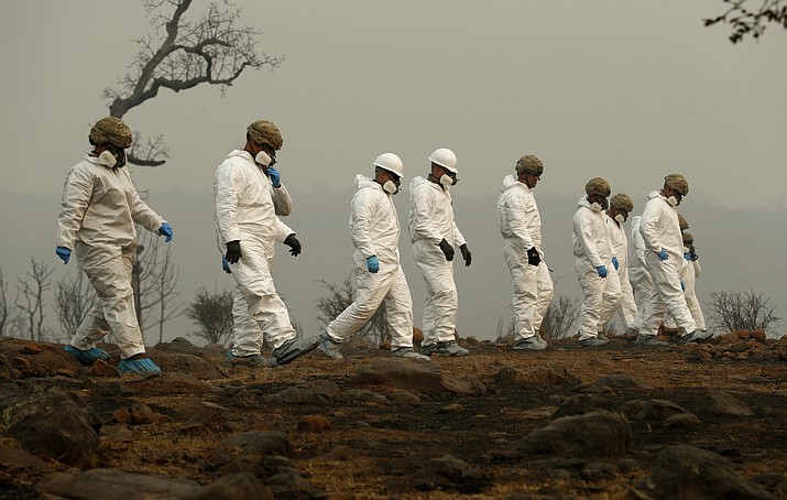 Members of the California Army National Guard search a property for human remains at the Camp fire, Wednesday, Nov. 14, 2018, in Paradise, Calif. (John Locher/AP)