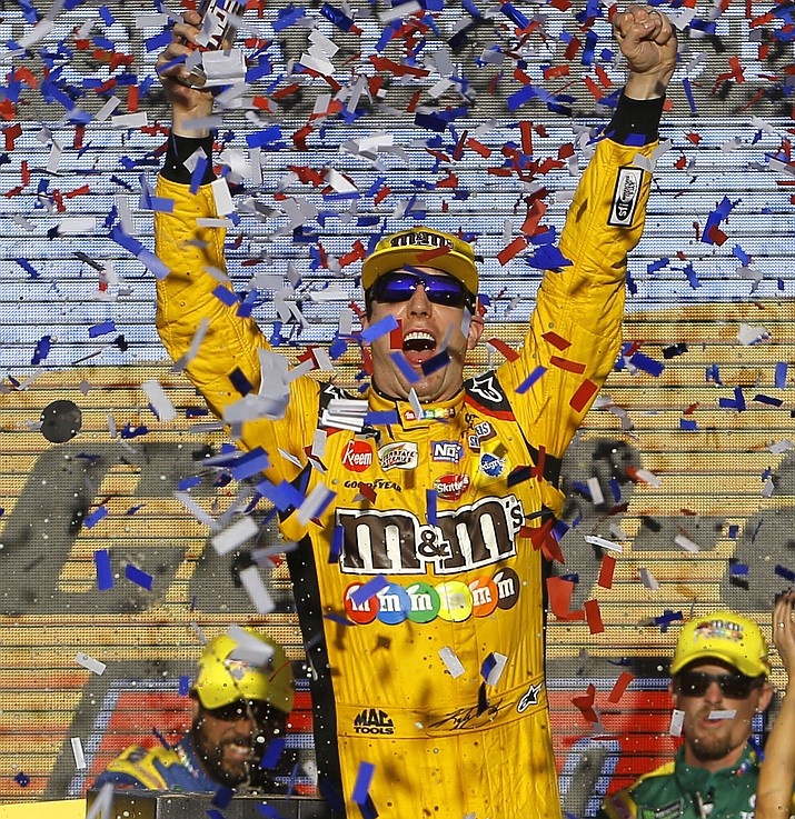 Kyle Busch celebrates after winning a NASCAR Cup Series auto race on Sunday, Nov. 11, 2018, in Avondale, Ariz. (Rick Scuteri/AP)