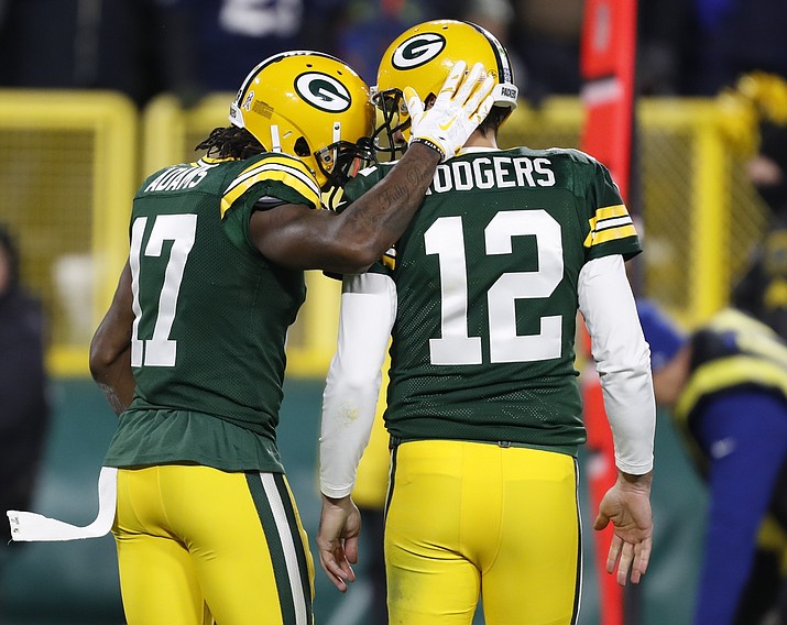 Green Bay Packers' Davante Adams celebrates his touchdown catch with Aaron Rodgers during the second half of an NFL football game against the Miami Dolphins Sunday, Nov. 11, 2018, in Green Bay, Wis. (Matt Ludtke/AP)