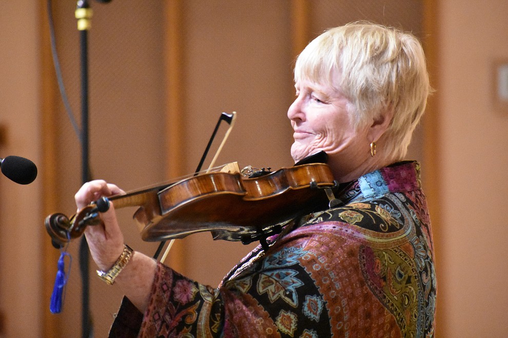 Nancy Carmichael plays prelude music before the interfaith Celebration of Thanks event on Nov. 15, 2018 at St. Luke's Episcopal Church in Prescott. The annual event, called "Many Voices of Thanks," brings together choirs, musicians, dancers and speakers from many faith beliefs and is sponsored by the Quad City Interfaith Council. (Richard Haddad/WNI)