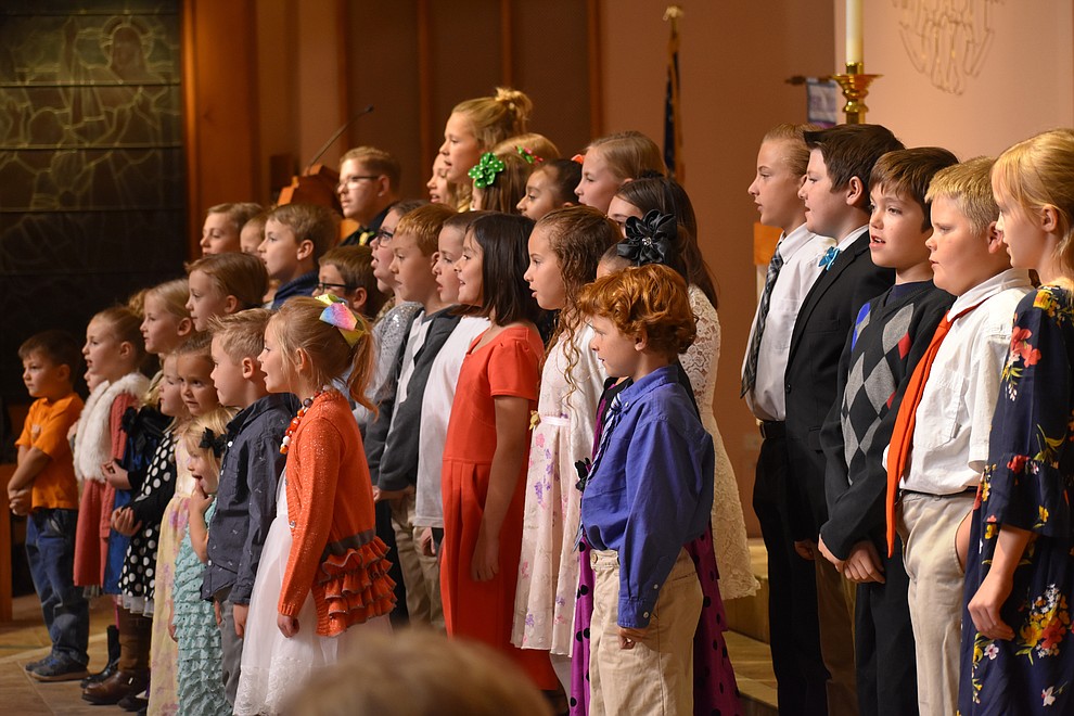 A children's choir from The Church of Jesus Christ of Latter-day Saints performs during the 2018 Celebration of Thanks concert held Thursday, Nov. 15 at St. Luke's Episcopal Church in Prescott. The annual event, called "Many Voices of Thanks," brings together choirs, musicians, dancers and speakers from many faith beliefs and is sponsored by the Quad City Interfaith Council. (Richard Haddad/WNI)