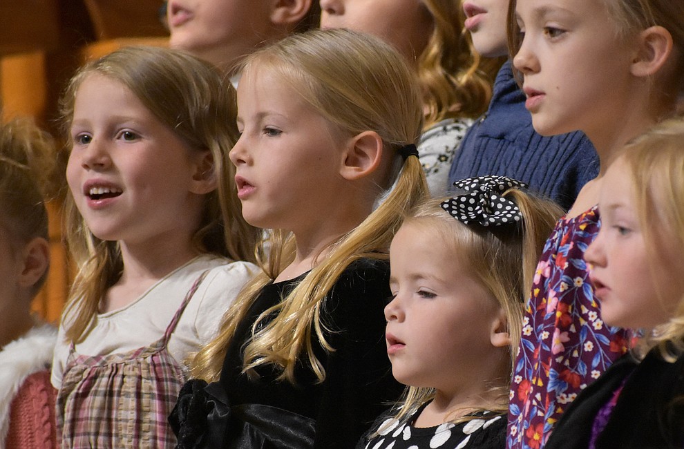 A children's choir from The Church of Jesus Christ of Latter-day Saints performs during the 2018 Celebration of Thanks concert held Thursday, Nov. 15 at St. Luke's Episcopal Church in Prescott. The annual event, called "Many Voices of Thanks," brings together choirs, musicians, dancers and speakers from many faith beliefs and is sponsored by the Quad City Interfaith Council. (Richard Haddad/WNI)