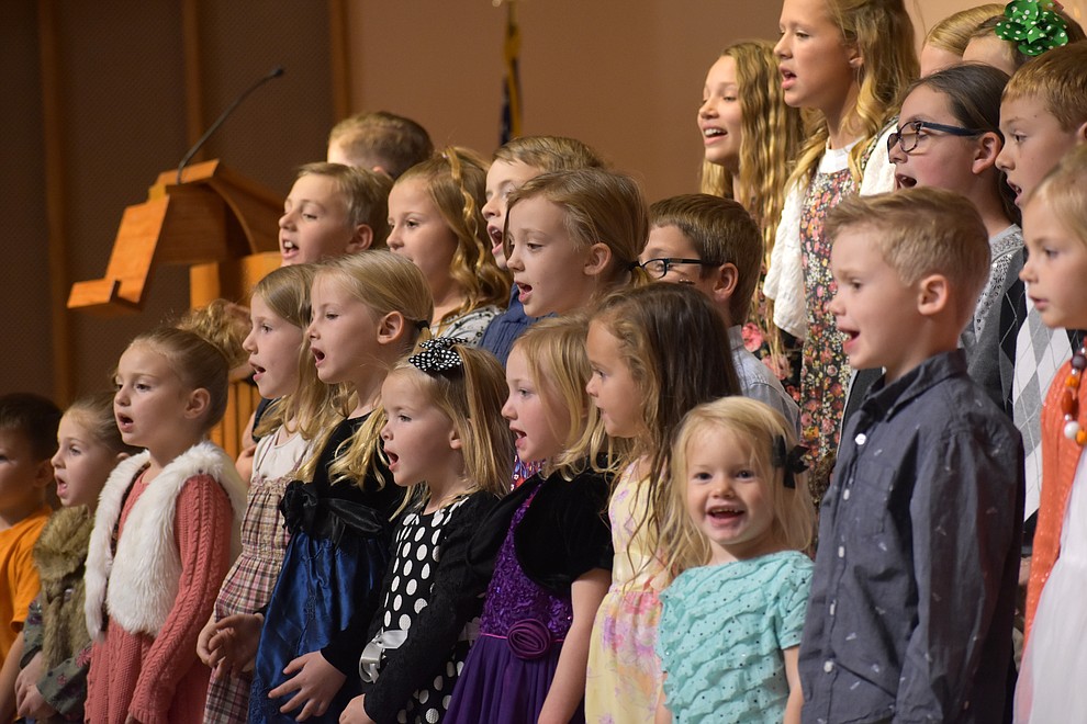 A children's choir from The Church of Jesus Christ of Latter-day Saints performs during the 2018 Celebration of Thanks concert held Thursday, Nov. 15 at St. Luke’s Episcopal Church in Prescott. The annual event, called "Many Voices of Thanks," brings together choirs, musicians, dancers and speakers from many faith beliefs and is sponsored by the Quad City Interfaith Council. (Richard Haddad/WNI)