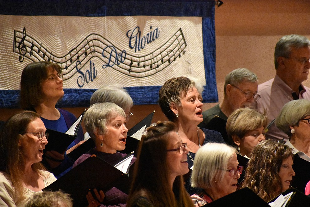 The St. Luke's Episcopal and United Methodist church choirs joined together to sing during the 2018 Celebration of Thanks concert held Nov. 15 at St. Luke's Episcopal Church in Prescott. The interfaith choir was under the direction of Dennis Houser (St. Luke’s) and Jacob Gilbert (UMC). The annual event, called "Many Voices of Thanks," brings together choirs, musicians, dancers and speakers from many faith beliefs and is sponsored by the Quad City Interfaith Council. (Richard Haddad/WNI)