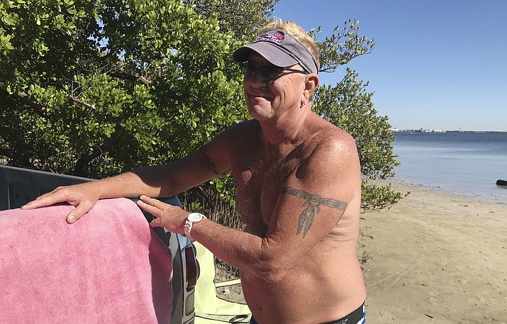 In this Nov. 16, 2018 photo, Mark Toepfer, a 58-year-old from Pinellas Park, reflects on the state's election while at the beach in St. Petersburg, Fla. Toepfer wondered why the state has so many problems counting ballots this year. (AP Photo/Tamara Lush)