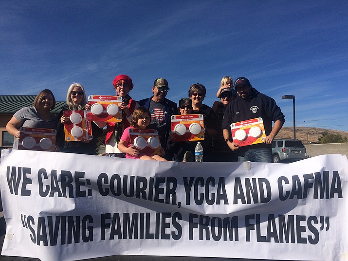 Prescott News Network's "Courier Cares" initiative, members of the Yavapai County Contractors Association, State Farm and Central Arizona Fire and Medical Authority teamed up to give away smoke alarms on Saturday, Nov. 17, 2018, at CAFMA Fire Station 50. (Jason Wheeler/Courier)