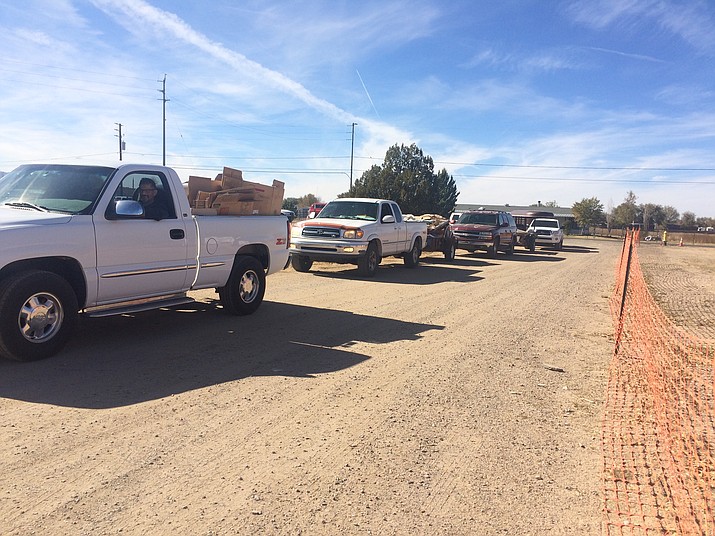 Chino Valley residents lined up to get rid of their excess waste at the town's Community Clean Up and Free Dump Day in the community center parking lot Sat. Nov. 17. (Jason Wheeler/Review)