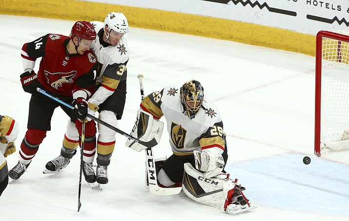 Vegas Golden Knights goaltender Marc-Andre Fleury (29) gives up a goal to Arizona Coyotes Derek Stepan as Coyotes right wing Richard Panik (14) and Golden Knights defenseman Brayden McNabb (3) look on during the first period of an NHL hockey game Wednesday, Nov. 21, 2018, in Glendale, Ariz. (AP Photo/Ross D. Franklin)
