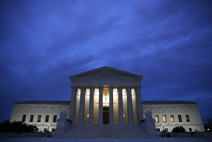 In this Sept. 27, 2018, file photo, The Supreme Court building is seen at dawn on Capitol Hill in Washington. (AP Photo/Patrick Semansky, File)