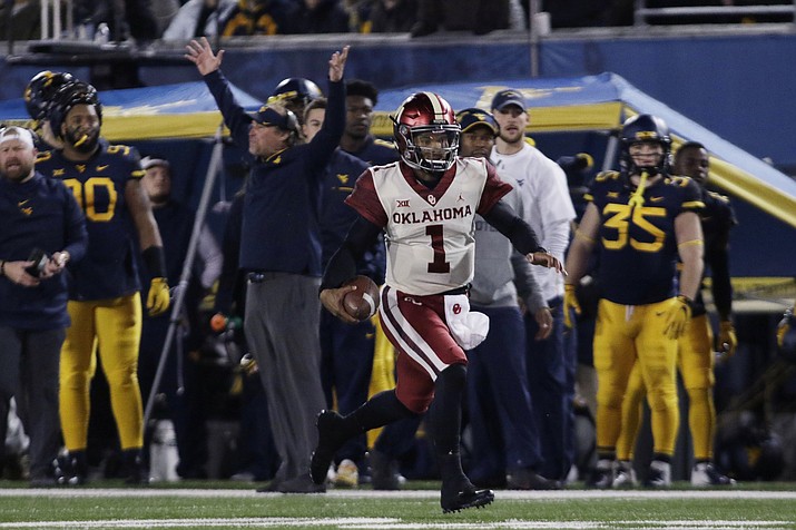 Oklahoma quarterback Kyler Murray (1) runs the ball for a touchdown during the first half of an NCAA college football game against West Virginia on Friday, Nov. 23, 2018, in Morgantown, W.Va. (Raymond Thompson/AP)