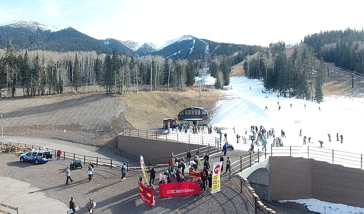 An aerial view of Snowbowl Nov. 16 shows man-made treated effluent on the mountain and the demonstration held by Protect the Peaks at the entrance to the chairlift. (Protect the Peaks)