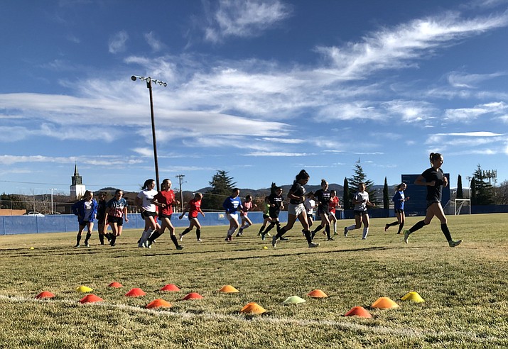 Prescott girls' soccer team warms-up prior to practice on Tuesday, Nov. 27, 2018 at Prescott High School. (Chris Whitcomb/Courier)