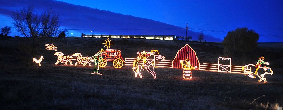 The Valley of Lights held their now annual stroll through Tuesday, Nov. 27, 2018 in Prescott Valley. The event allows people to walk through the display and for people to take their time seeing all the dsiplays while enjoying carolers and hot chocolate at various stops along the way. (Les Stukenberg/Courier).
