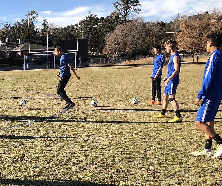Prescott boys' soccer team warms-up prior to practice on Tuesday, Nov. 27, 2018 at Prescott High School. (Chris Whitcomb/Courier)